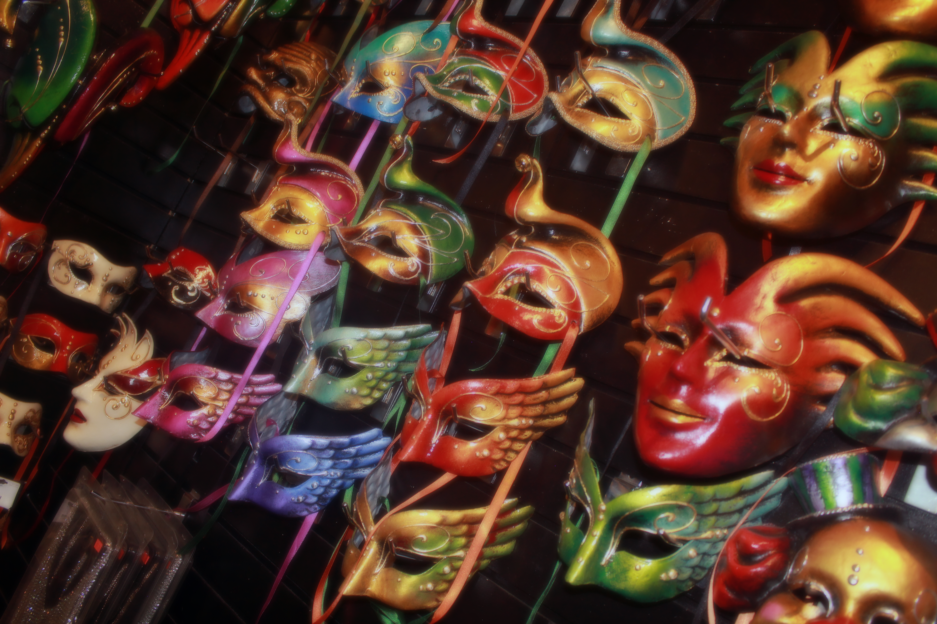 Wall of beautiful handmade paper-mache masquerade masks in NYC goth store